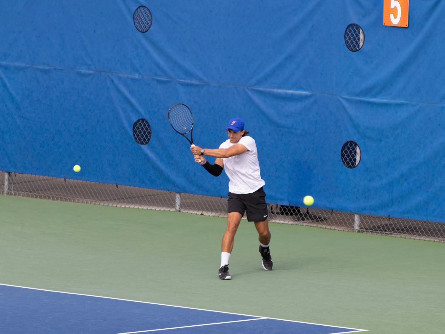 Florida graduate student JanMagnus Johnson rips a backhand in the Gators’ 7-0 win against The Citadel on Friday, Jan. 19, 2024.
