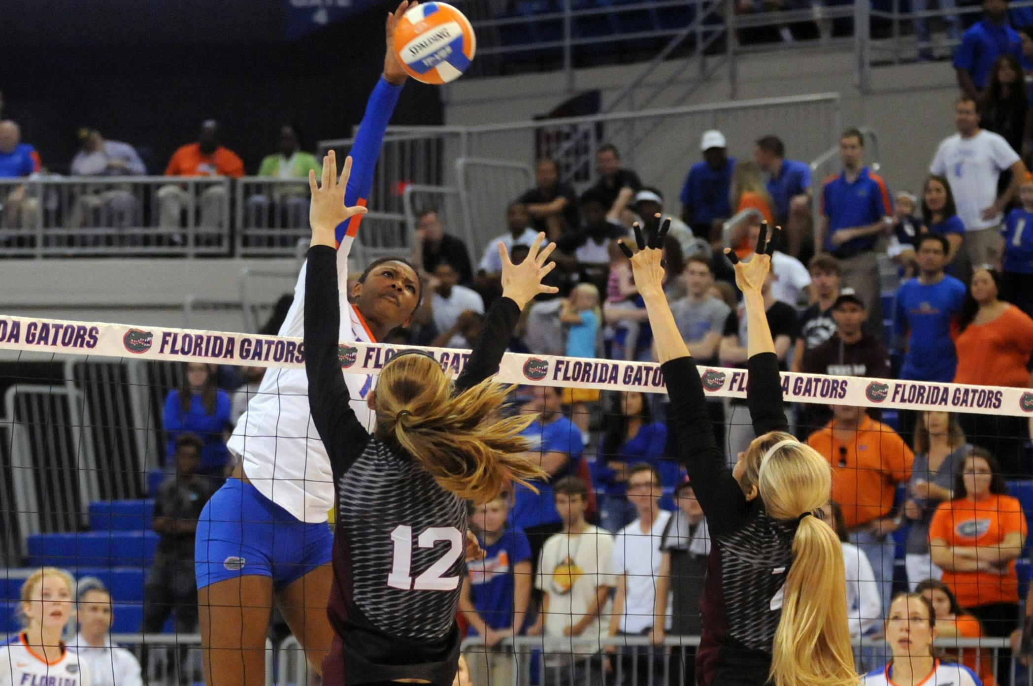 UF middle blocker Rhamat Alhassan swings for a kill during Florida's 3-0 win against Texas A&amp;M on Oct. 9, 2015, in the O'Connell Center.