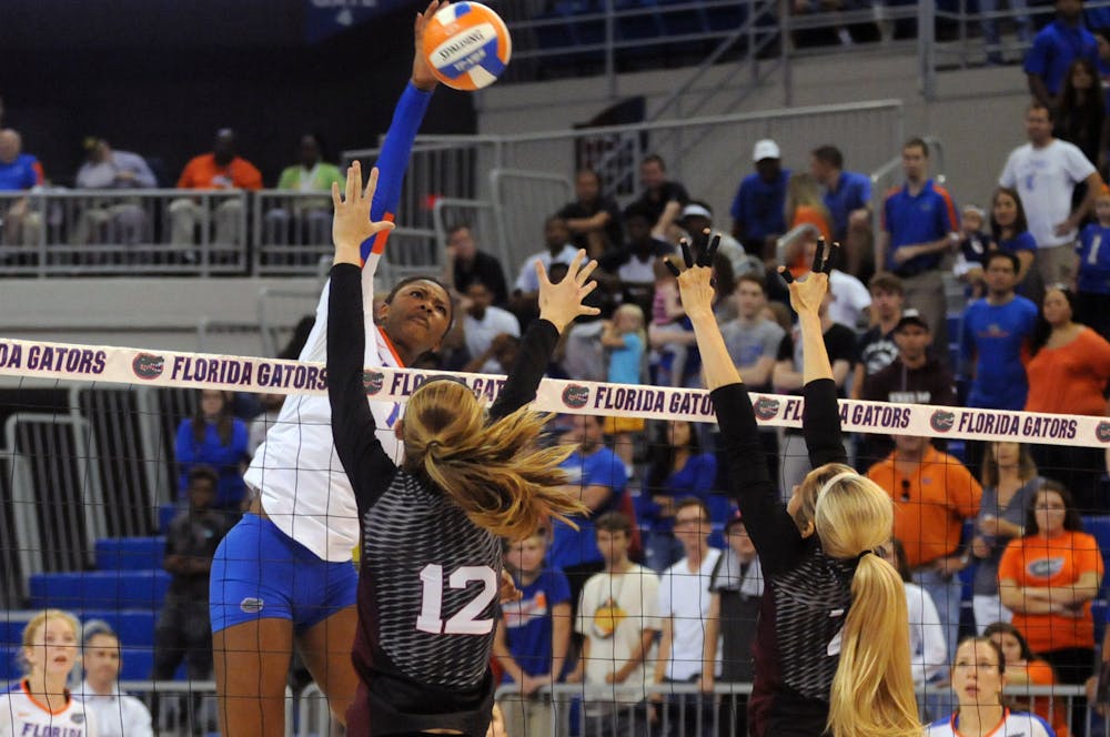 <p>UF middle blocker Rhamat Alhassan swings for a kill during Florida's 3-0 win against Texas A&amp;M on Oct. 9, 2015, in the O'Connell Center.</p>