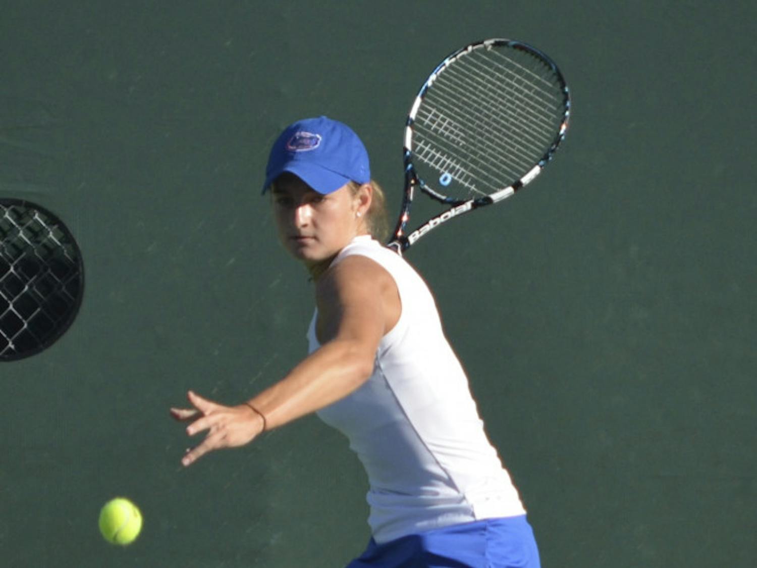 Freshman Kourtney Keegan swings at the ball during the second day of the Bedford Cup on Oct. 11 at the Ring Tennis Complex.