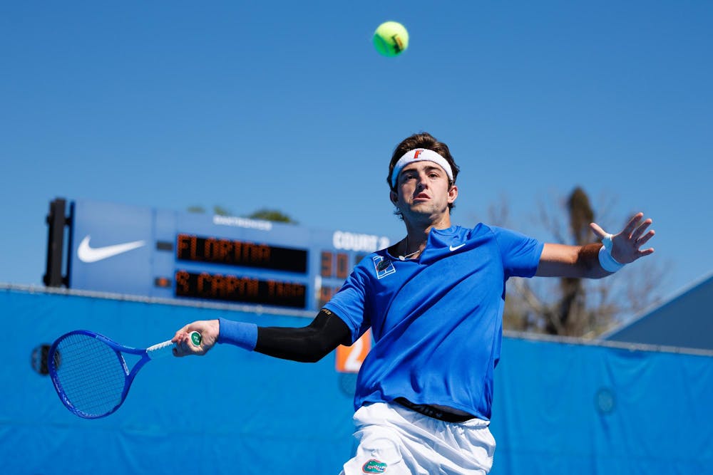 Florida Gators tennis player Pablo Perez Ramos jumps to hit the ball during an NCAA tennis match against South Carolina, Sunday, March. 1, 2026, in Gainesville, Fla.