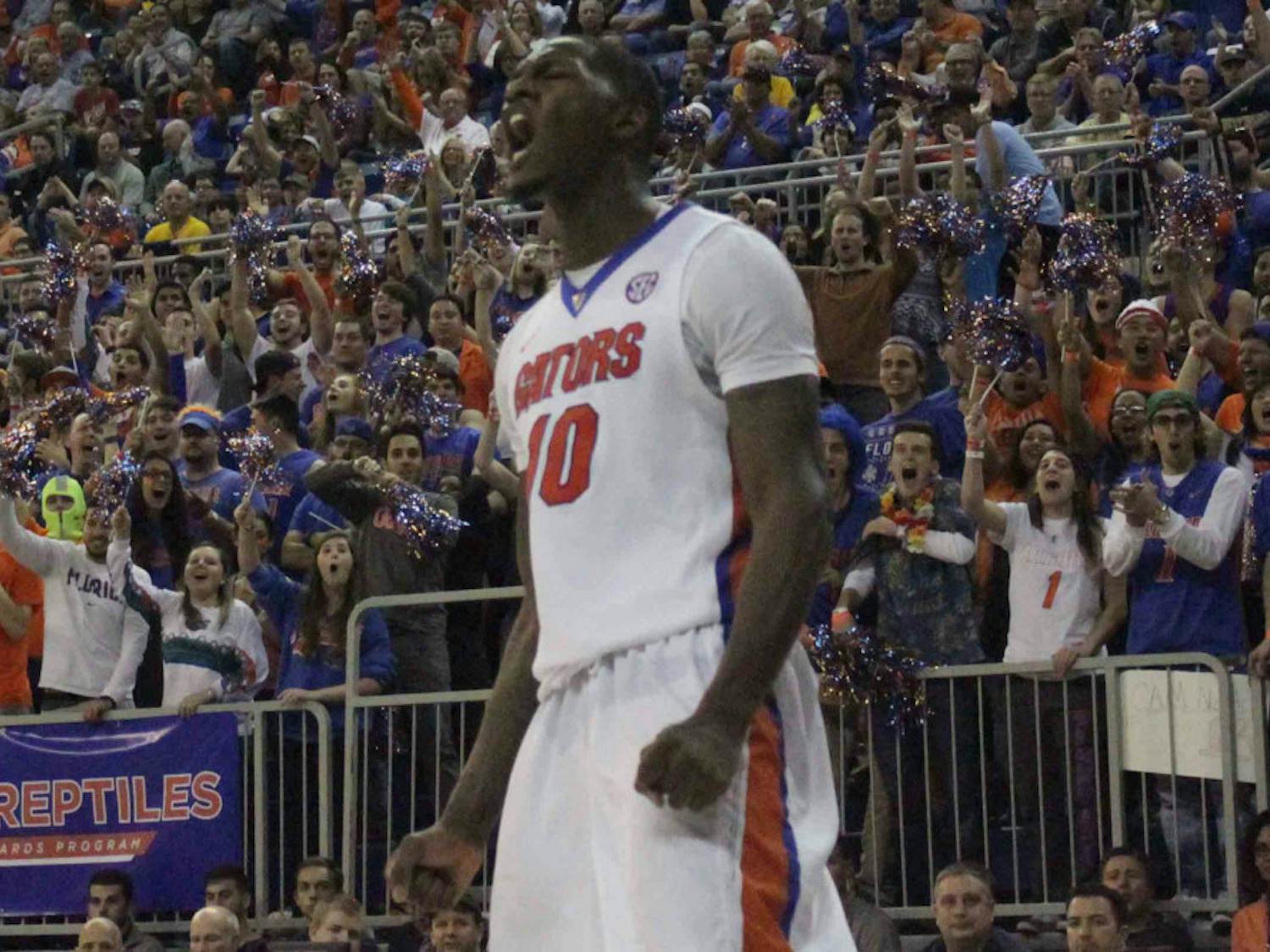 Dorian Finney-Smith screams after a dunk during Florida’s win over West Virginia on Jan. 30, 2016, in the O’Connell Center.