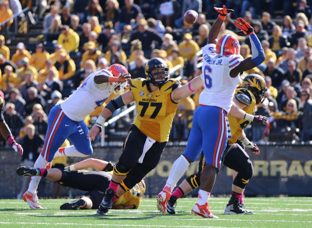 <p>Dante Fowler Jr. (6) attempts to block a pass during Florida’s 36-17 loss to Missouri on Saturday at Faurot Field in Columbia, Mo. Tigers quarterback Maty Mauk threw for a career-high 295 yards during the game to help Missouri accumulate 500 yards of total offense — the most UF has allowed under coach Will Muschamp.</p>