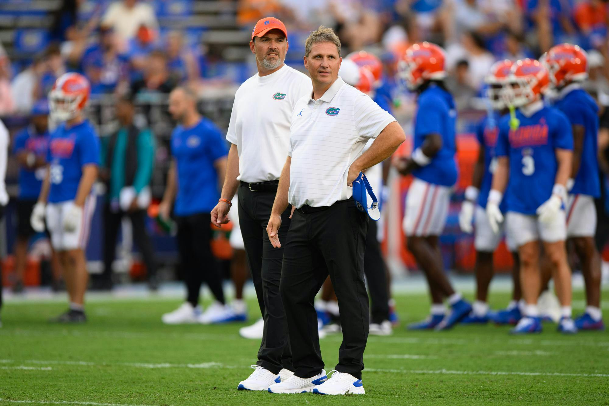 Florida offensive coordinator Buster Faulkner watches warmups before an NCAA college football game against FAU, Saturday, Sept. 5, 2026, in Gainesville, Fla.