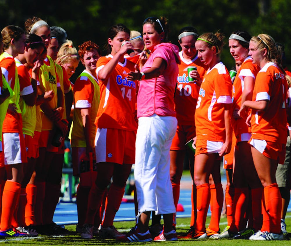 <p>Florida coach Becky Burleigh (center) said the Gators didn’t panic after allowing a goal in the first minute against Mississippi State on Sunday, but No. 11 UF lost 1-0 in Starkville, Miss.</p>