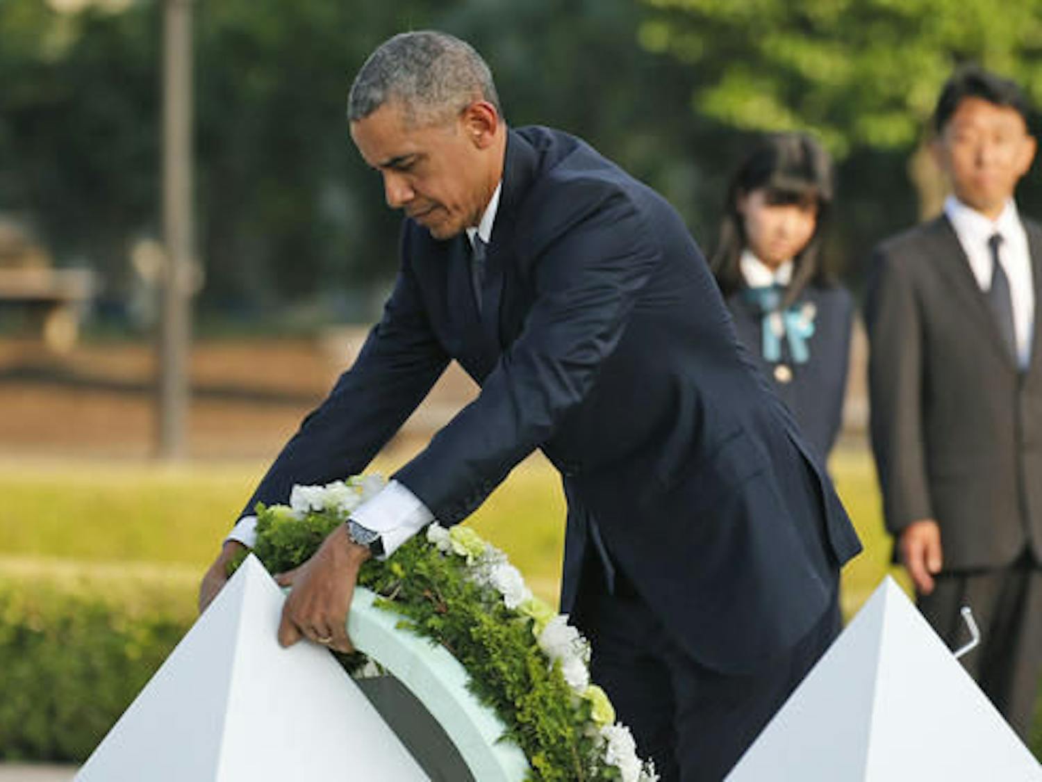 U.S. President Barack Obama lays wreaths at the cenotaph at Hiroshima Peace Memorial Park in Hiroshima, western Japan, Friday, May 27, 2016. Obama on Friday became the first sitting U.S. president to visit the site of the world's first atomic bomb attack, bringing global attention both to survivors and to his unfulfilled vision of a world without nuclear weapons. (AP Photo/Shuji Kajiyama)
