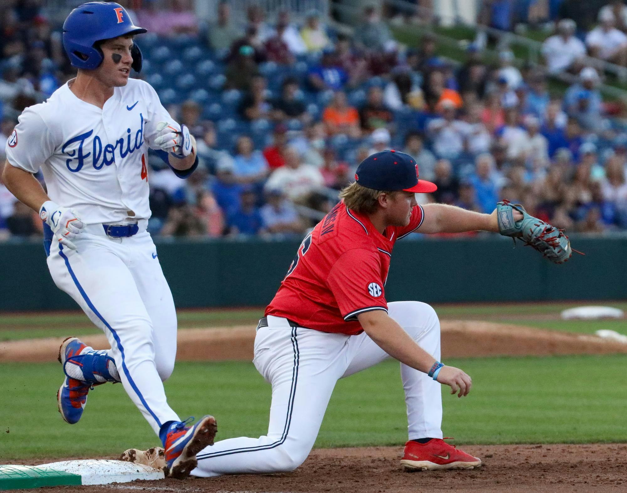 Ole Miss infielder Will Furniss (36) gets out Cade Kurland (4) at first base during an NCAA college baseball game against Florida, Thursday, April 2, 2026, in Gainesville, Fla.