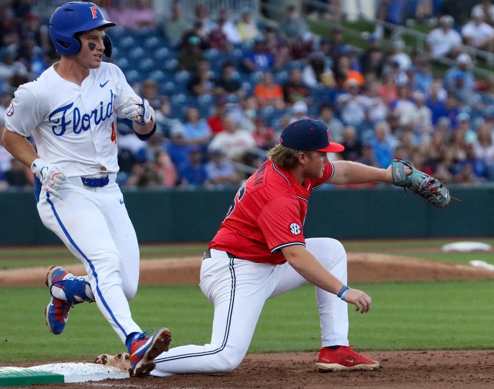 Ole Miss infielder Will Furniss (36) gets out Cade Kurland (4) at first base during an NCAA college baseball game against Florida, Thursday, April 2, 2026, in Gainesville, Fla.