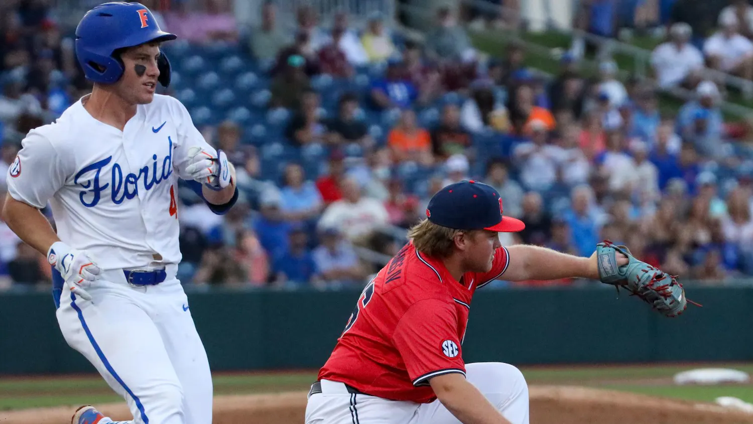 Ole Miss infielder Will Furniss (36) gets out Cade Kurland (4) at first base during an NCAA college baseball game against Florida, Thursday, April 2, 2026, in Gainesville, Fla.