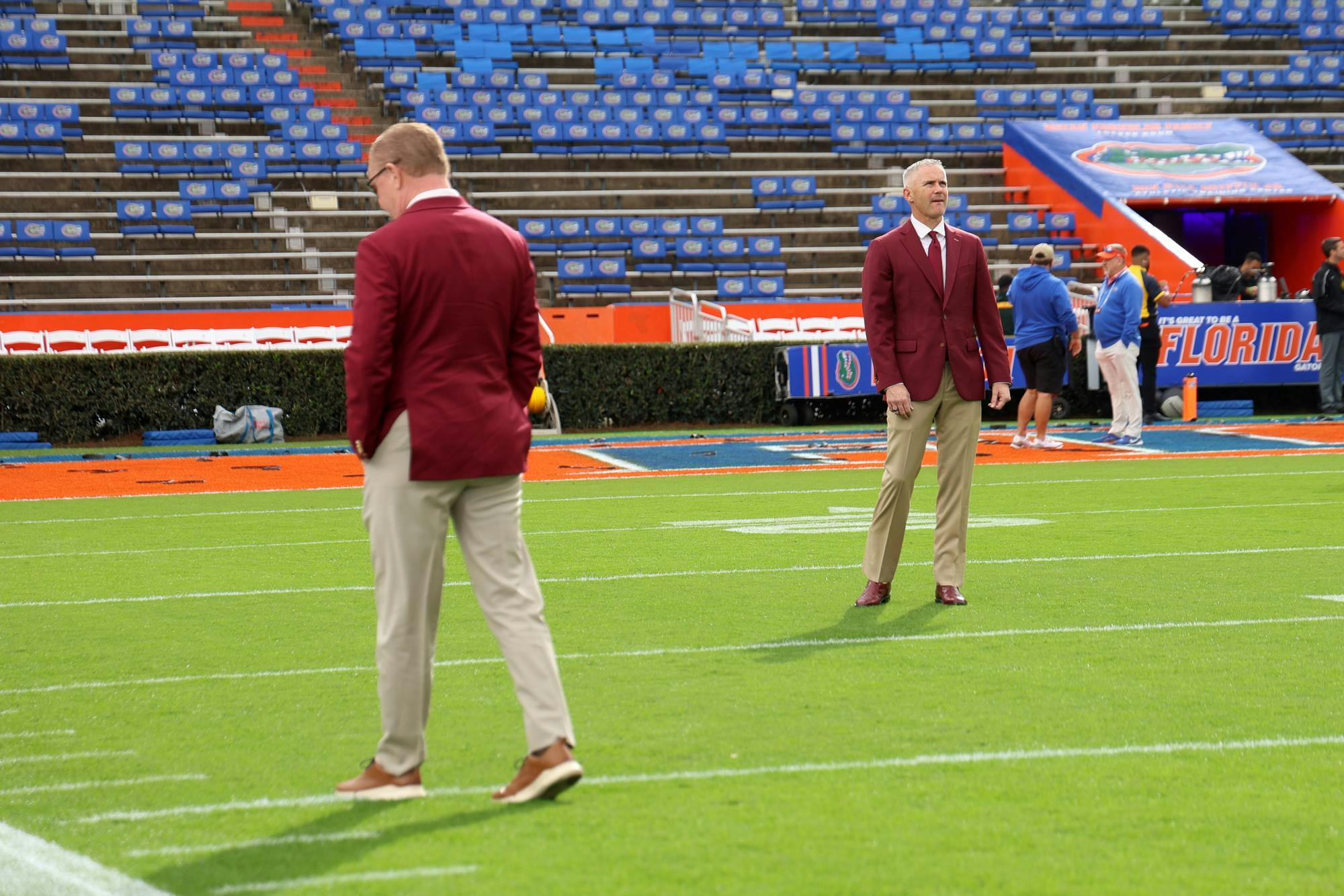 FSU Head Coach Mike Norvell takes a look around on the Steve Spurrier Field just before their rivalry game against UF on Saturday, Nov. 29, 2025.