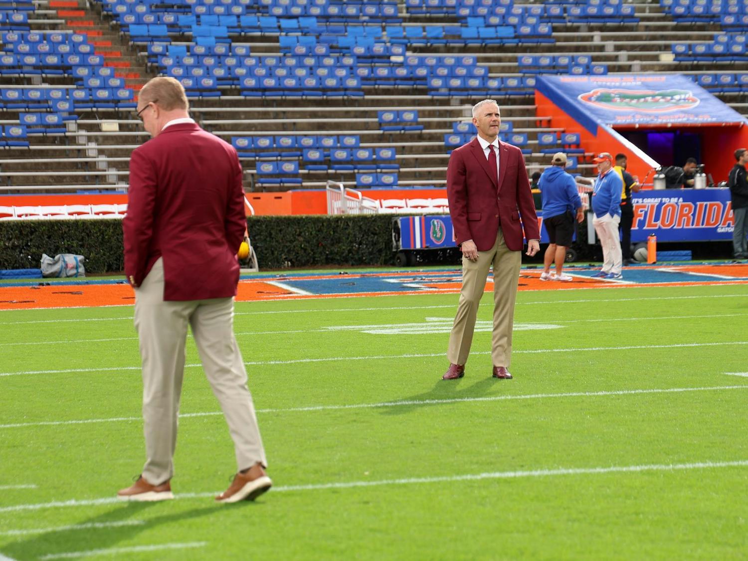 FSU Head Coach Mike Norvell takes a look around on the Steve Spurrier Field just before their rivalry game against UF on Saturday, Nov. 29, 2025.