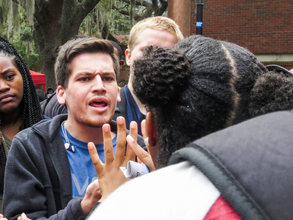 <p dir="ltr">Chris Salazar, a 19-year-old UF finance freshman, argues in a tight group on Turlington Plaza during a protest against President-elect Donald Trump on Monday. "He's my president,” Salazar said after arguing. “Democracy decided. I'm going to support him." Read more on page 3.</p><div dir="ltr"> </div>