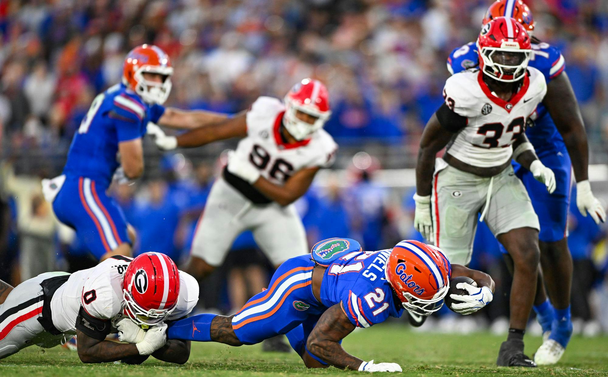 Florida running back KD Daniels (21) reaches with the ball during a NCAA college football game, Saturday, Nov. 1, 2025, in Jacksonville, Fla.
