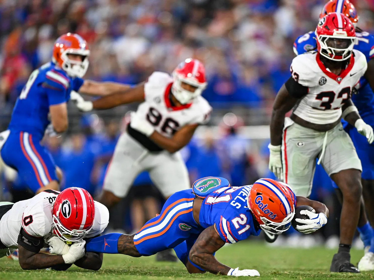 Florida running back KD Daniels (21) reaches with the ball during a NCAA college football game, Saturday, Nov. 1, 2025, in Jacksonville, Fla.