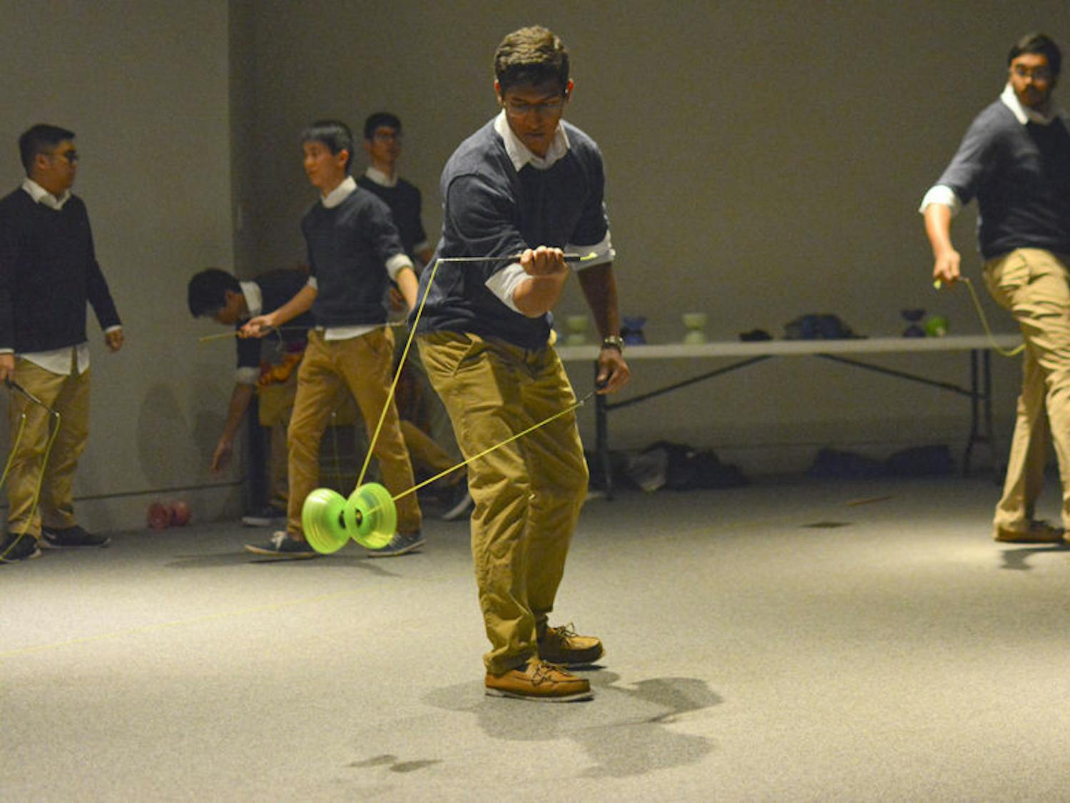 Members of Vertax, a yo-yo group comprised of UF students, demonstrate Chinese yo-yo tricks at the Samuel P. Harn Museum of Art. A variety of organizations performed and led activities on Thursday for Asia or Bust, a part of the Museum Nights series at the Harn.
