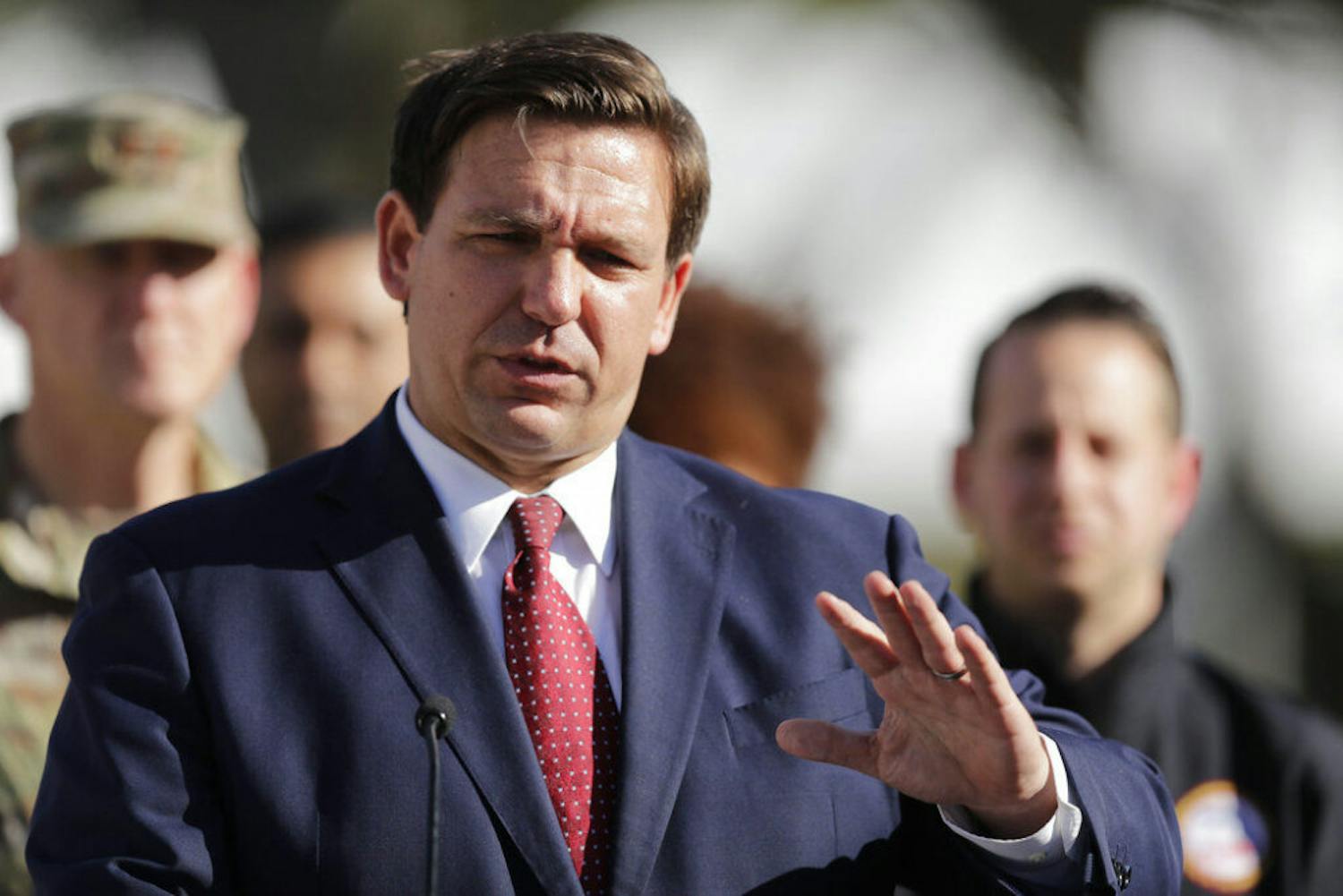 Florida Gov. Ron DeSantis speaks during a news conference at C.B. Smith Park, Thursday, March 19, 2020, in Pembroke Pines, Fla. The park will be used for a drive thru COVID-19 testing facility. (AP Photo/Brynn Anderson)