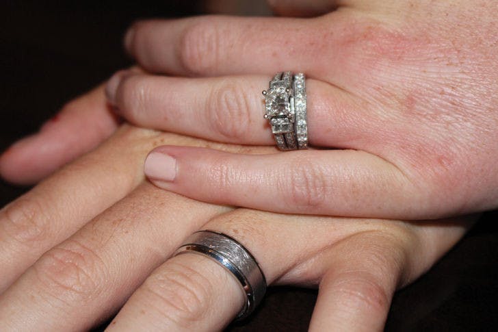 UF journalism alumnus Cody Jones, 25, holds hands with his wife, Lacey, a 23-year-old UF public relations alumna. A recent study suggests remarriage rates are declining as couples choose to live together.