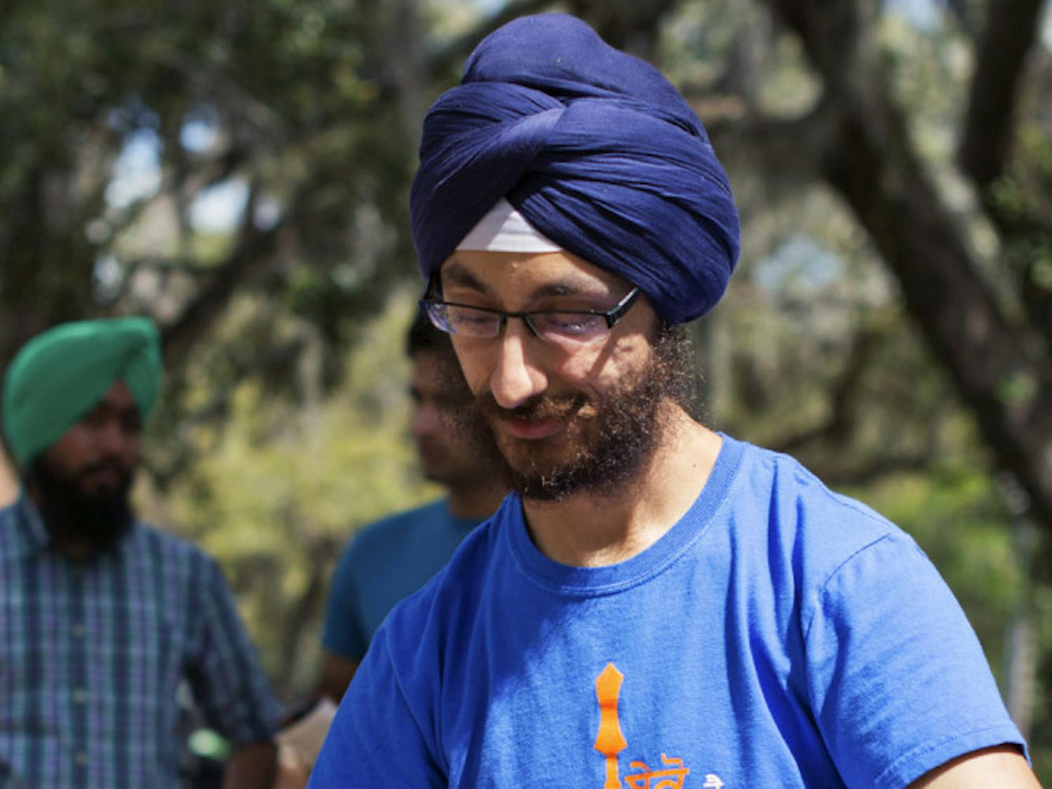 Neal Singh, 24, a second-year dental student wraps Narayan Kulkarni's head in a Sikh turban as part of the Sikh Students Association bi-annual Turban Day.