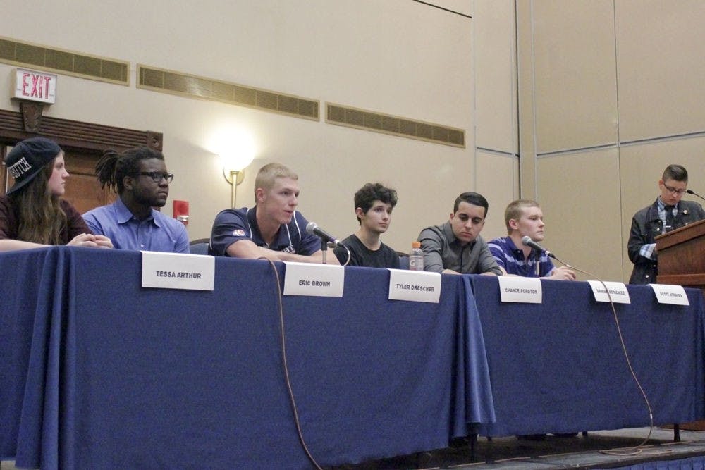 From left, Tessa Arthur, Eric Brown, Tyler Drescher, Chance Forston, Damian Gonzales, Scott Strauss and LB Hannahs participate in Women’s History Month’s Masculine Mystique panel. The group discussed how concepts of masculinity have influenced their lives and gender expressions.