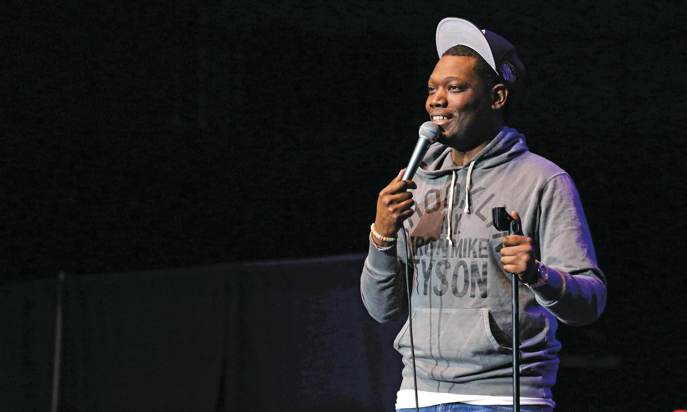 Michael Che, a cast member of “Saturday Night Live,” performs stand-up comedy at UF’s O’Connell Center on Wednesday night. Che and fellow cast member Kenan Thompson were paid $100,000 for the show, hosted by the Accent Speakers Bureau.