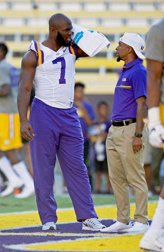 Leonard Fournette (7) chats on the field before an NCAA college football game against Missouri in Baton Rouge, Louisiana, on Oct. 1, 2016.
