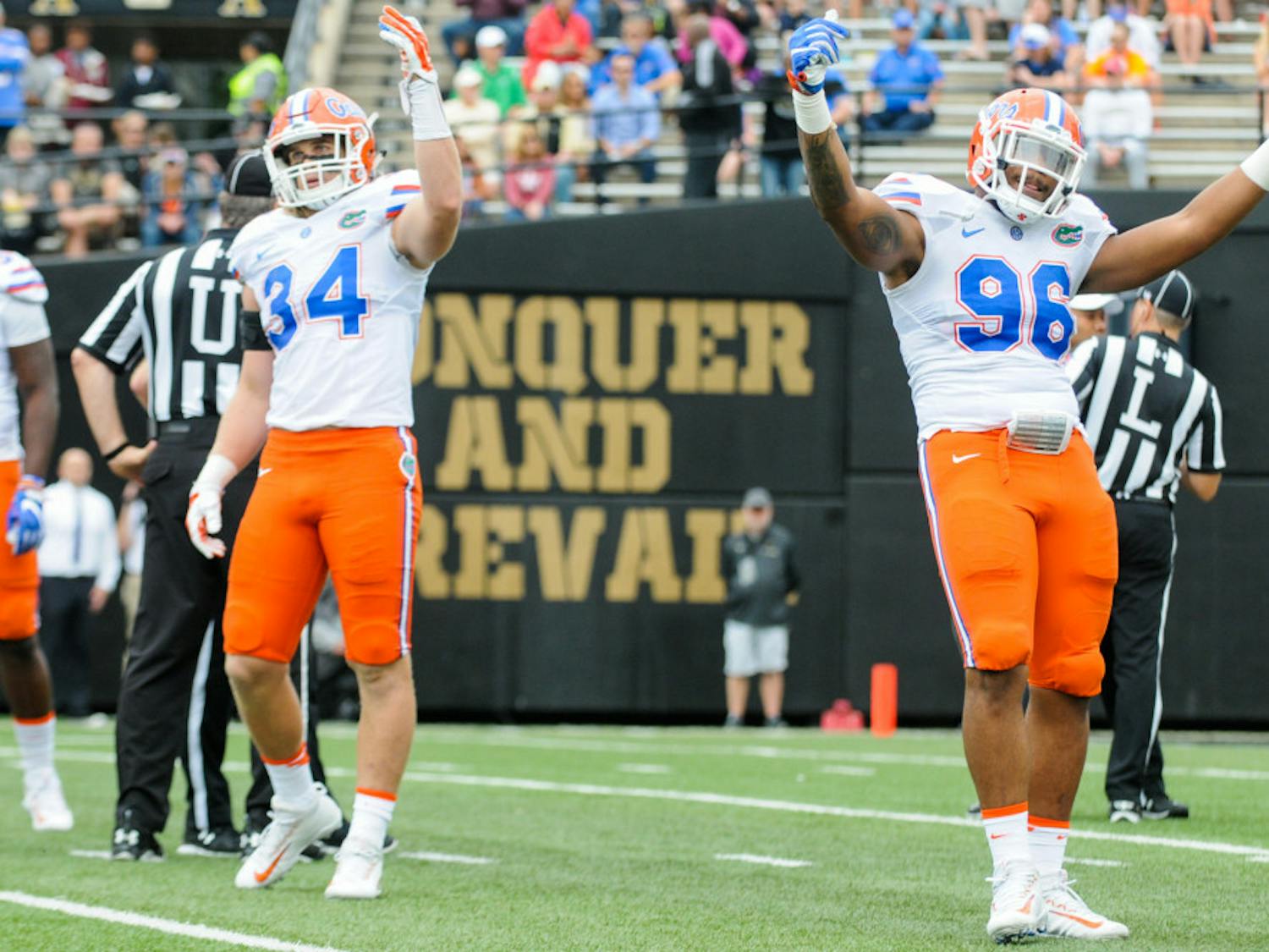Alex Anzalone (34) and CeCe Jefferson (96) motion to the crowd during Florida's 13-6 win over Vanderbilt on Oct. 1 in Nashville. "He doesn't hold anything back," linebacker Jarrad Davis said of Anzalone. "He lets everything go, and that's what we want from our teammates."