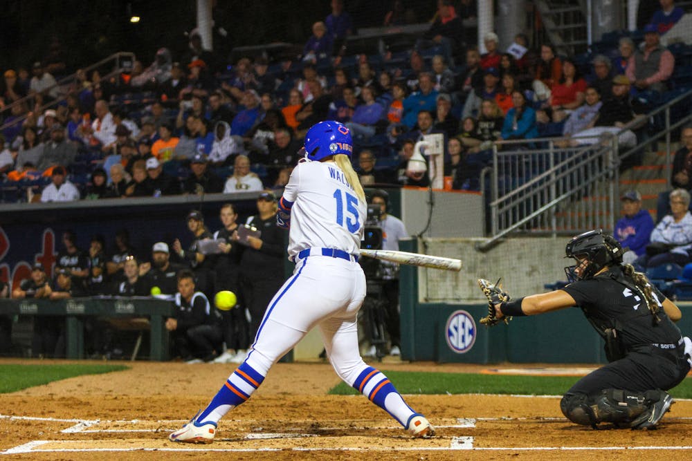 Florida infielder Reagan Walsh swings her bat during the Gators' 3-0 win against the Central Florida Knights Wednesday, March 8, 2023.