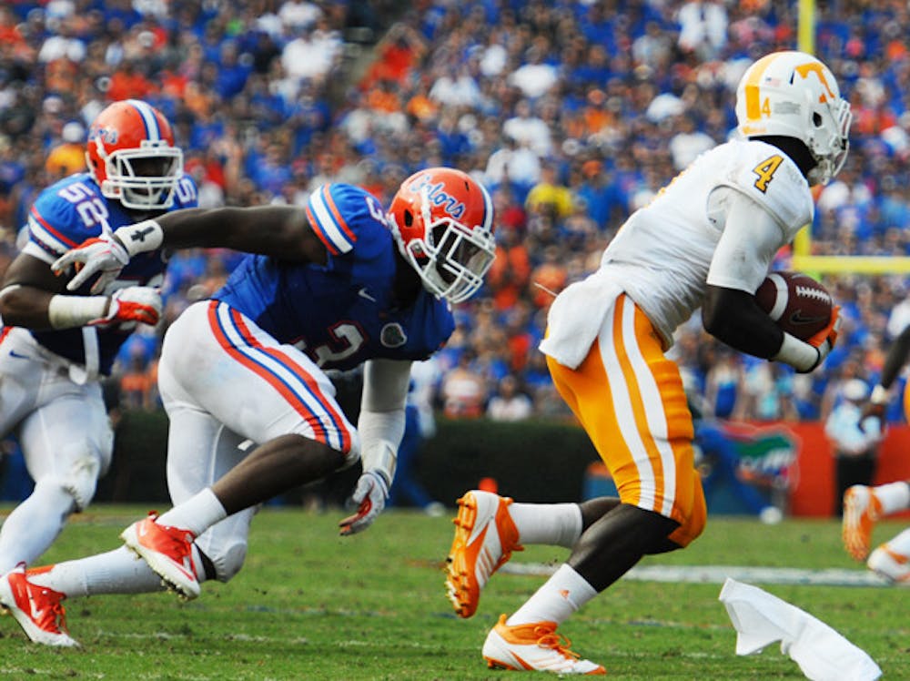 <p>Gators linebackers Jon Bostic (52) and Jelani Jenkins (3) helped limit Tennessee to minus-9 yards rushing Saturday — the lowest total for a UF defense since 2006.</p>