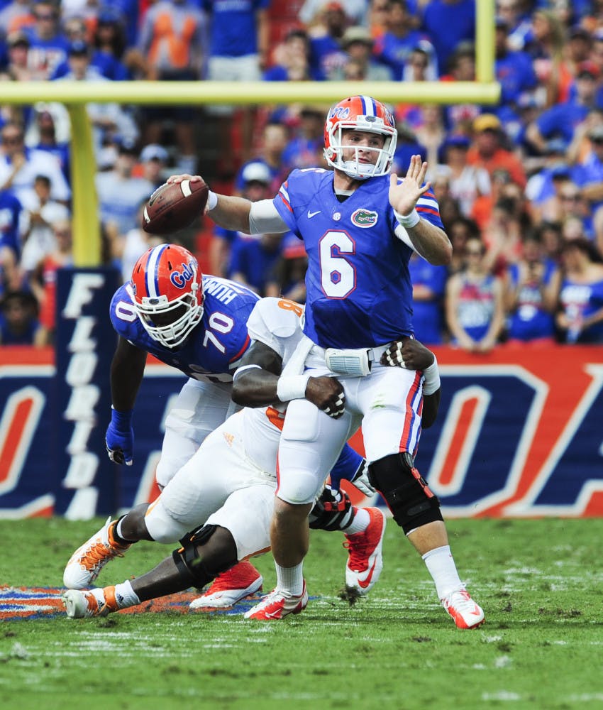 Quarterback Jeff Driskel tries to escape a tackle during Florida's 31-17 win against Tennessee on Saturday in Ben Hill Griffin Stadium.