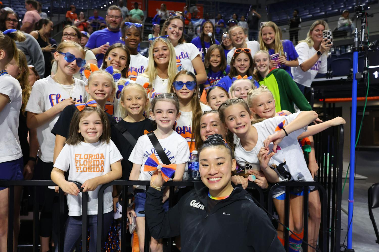 Leanne Wong poses with fans holding her bow after the NCAA Gainesville Regional Championship on Sunday, April 7, 2024.