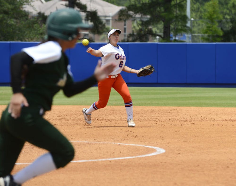 <p>Shortstop Katie Medina throws out a USF runner of on Saturday at Katie Seashole Pressly Stadium. UF defeated USF 2-0 Sunday to advance to the NCAA Super Regional.</p>