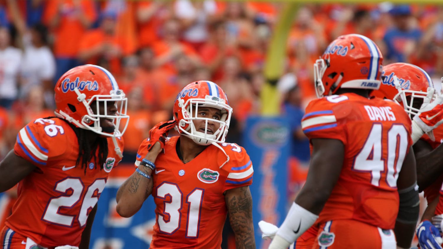 Jalen tabor (31) celebrates with teammates after intercepting a pass during Florida's 45-7 win over Kentucky on Sept. 10, 2016, at Ben Hill Griffin Stadium.