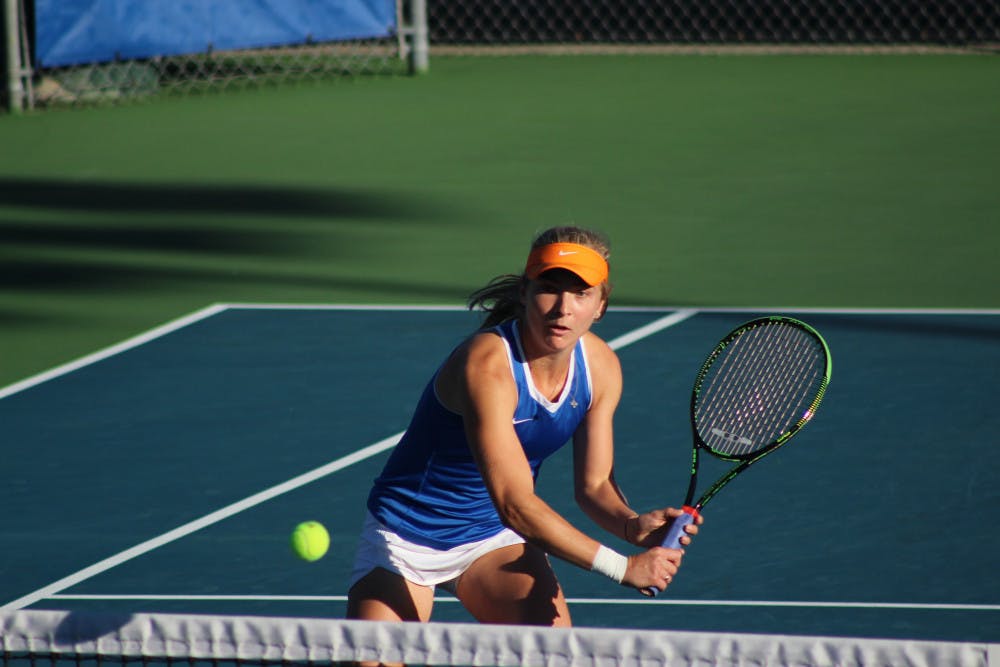 <p>Josie Kuhlman returns a ball during the ITA Regional Championships on Oct. 22, 2016, at the Ring Tennis Complex.</p>