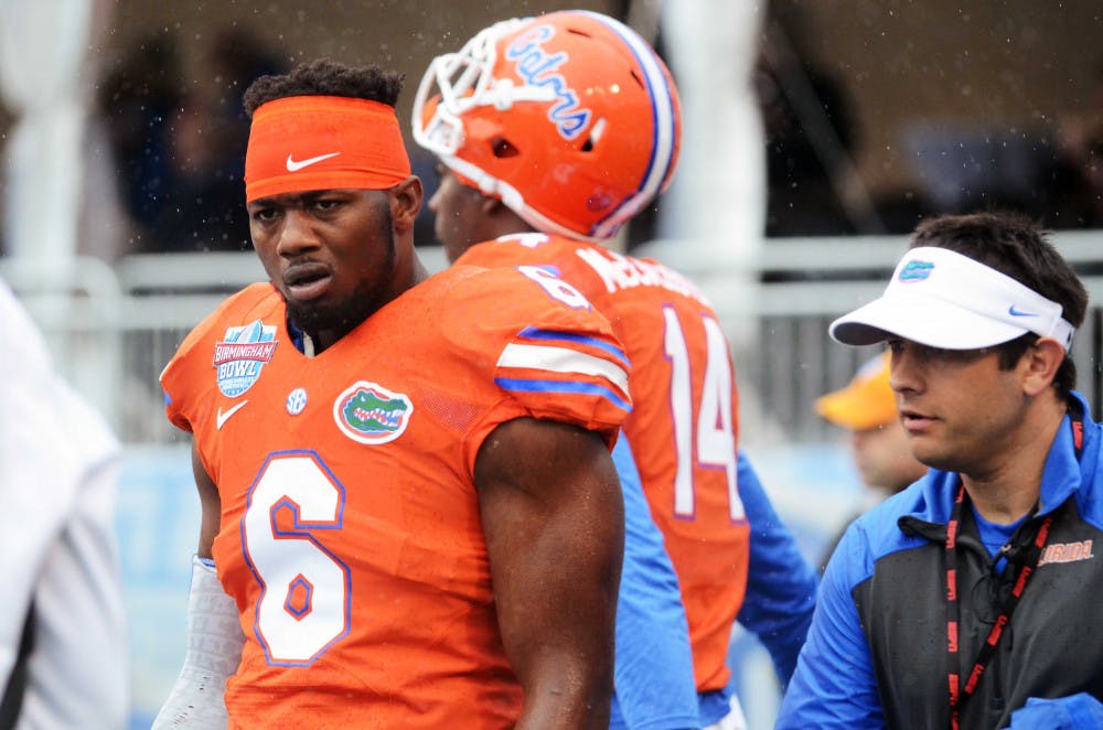 Dante Fowler looks down the field prior to the start of Florida's 28-20 win against East Carolina in the Birmingham Bowl at Legion Field on Saturday.