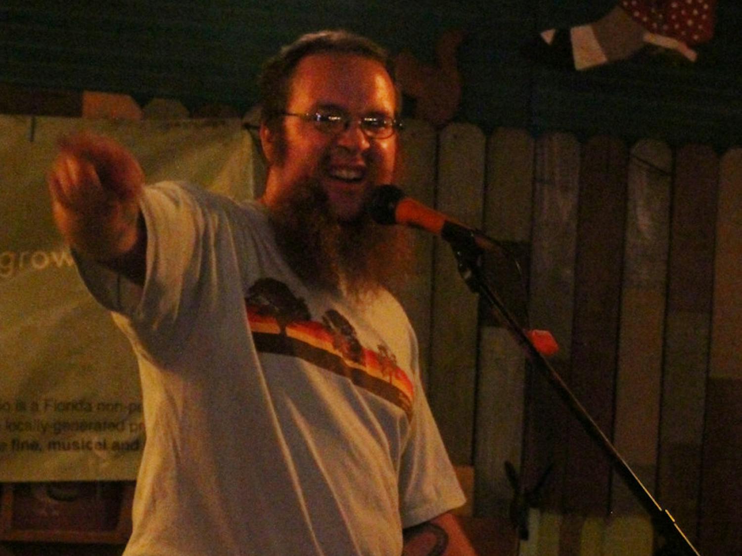 Satchel's Pizza bartender Jordan Borstelmann, 31, tells an anecdote at Grow Radio's storytelling event, The Conch. The event was at Satchel's Pizza, and performing members had five minutes to tell stories.