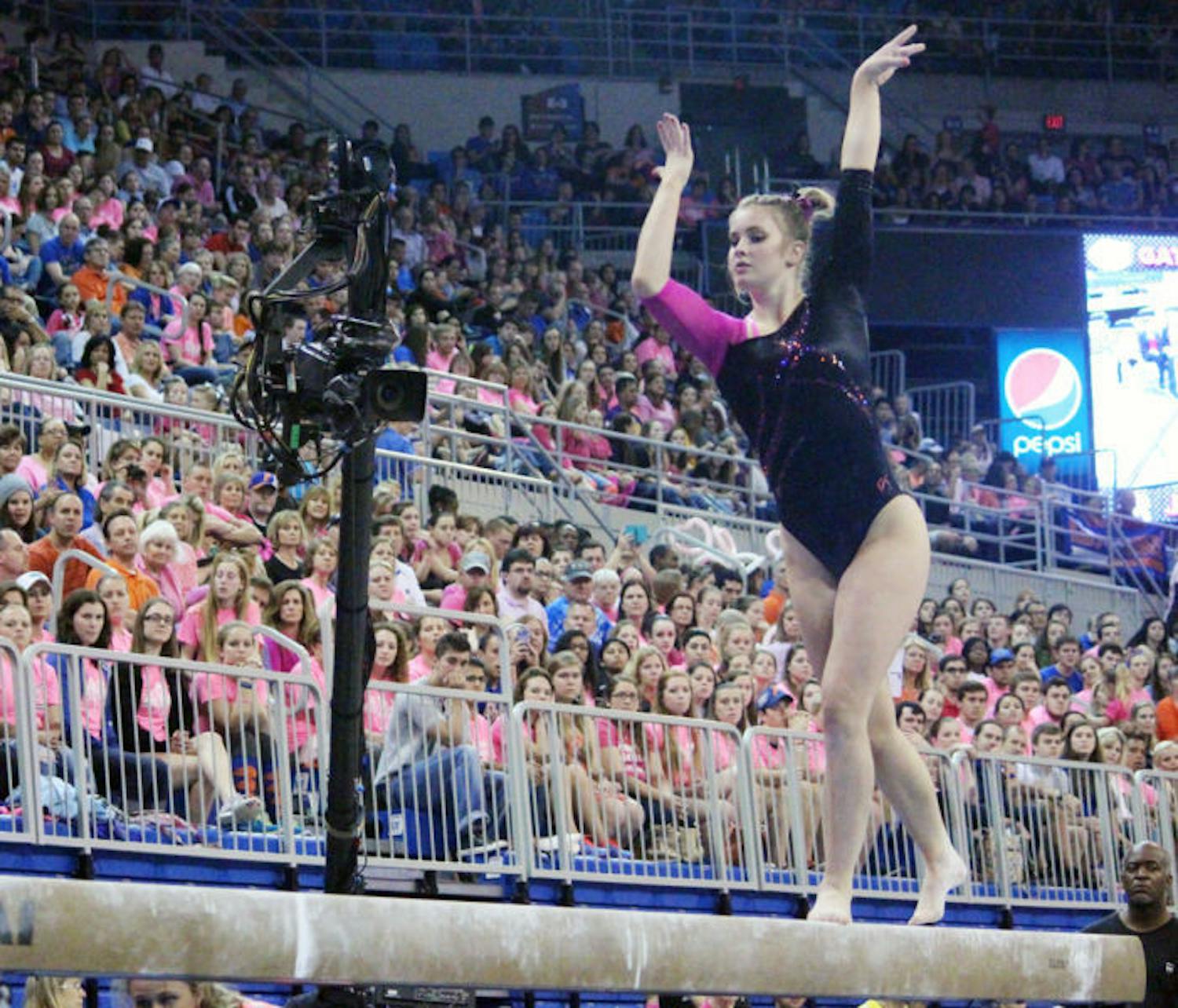 Claire Boyce competes on the balance beam during UF’s win against LSU on&nbsp;Feb. 21 in the O’Connell Center.