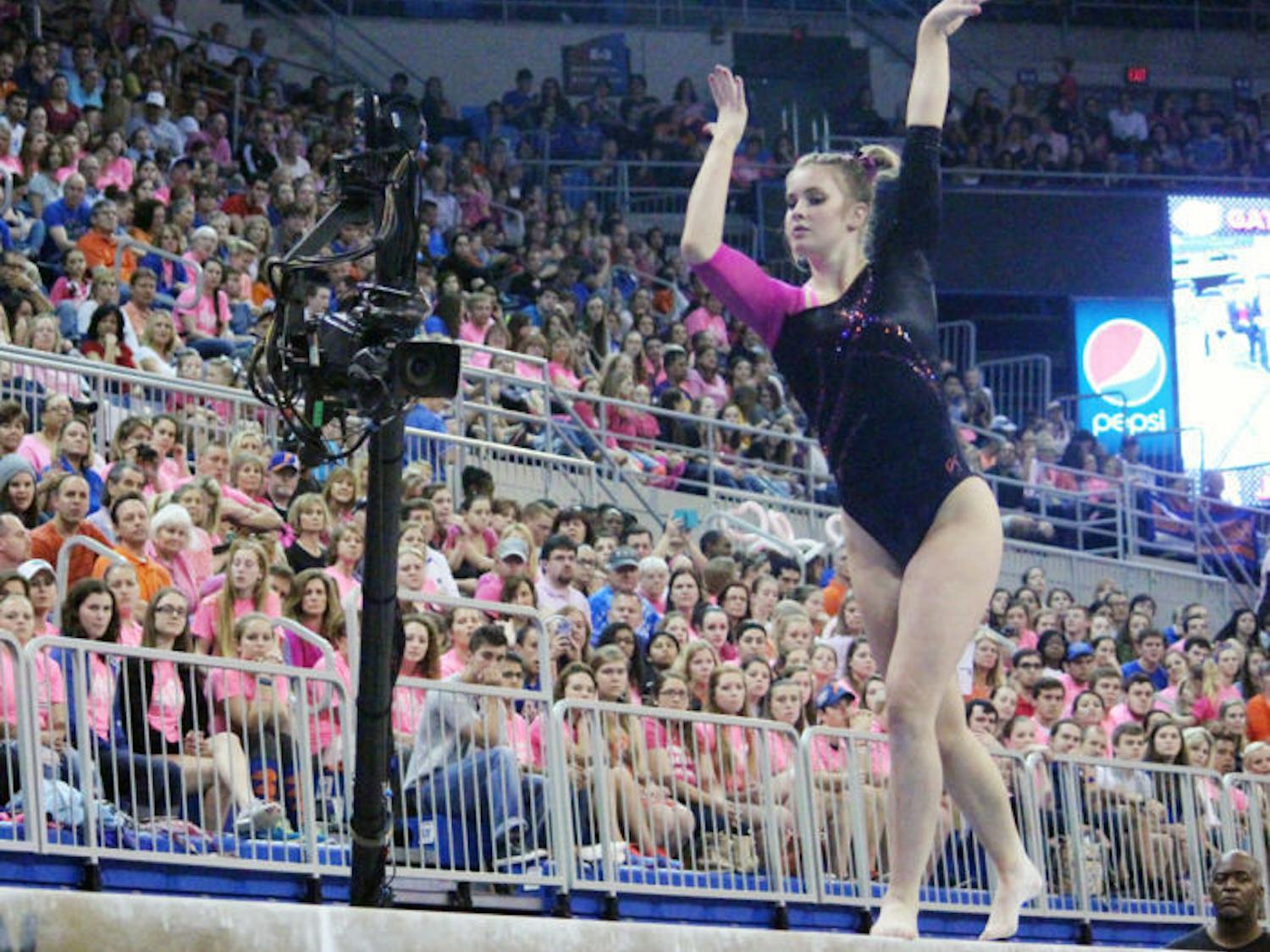 Claire Boyce competes on the balance beam during UF’s win against LSU on Feb. 21 in the O’Connell Center.