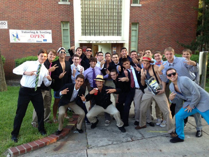 Twenty-two Broward Hall residents pose for a photo prior to a scheduled meeting with two UPD officers and housing staff about a prank the group is suspected of pulling.