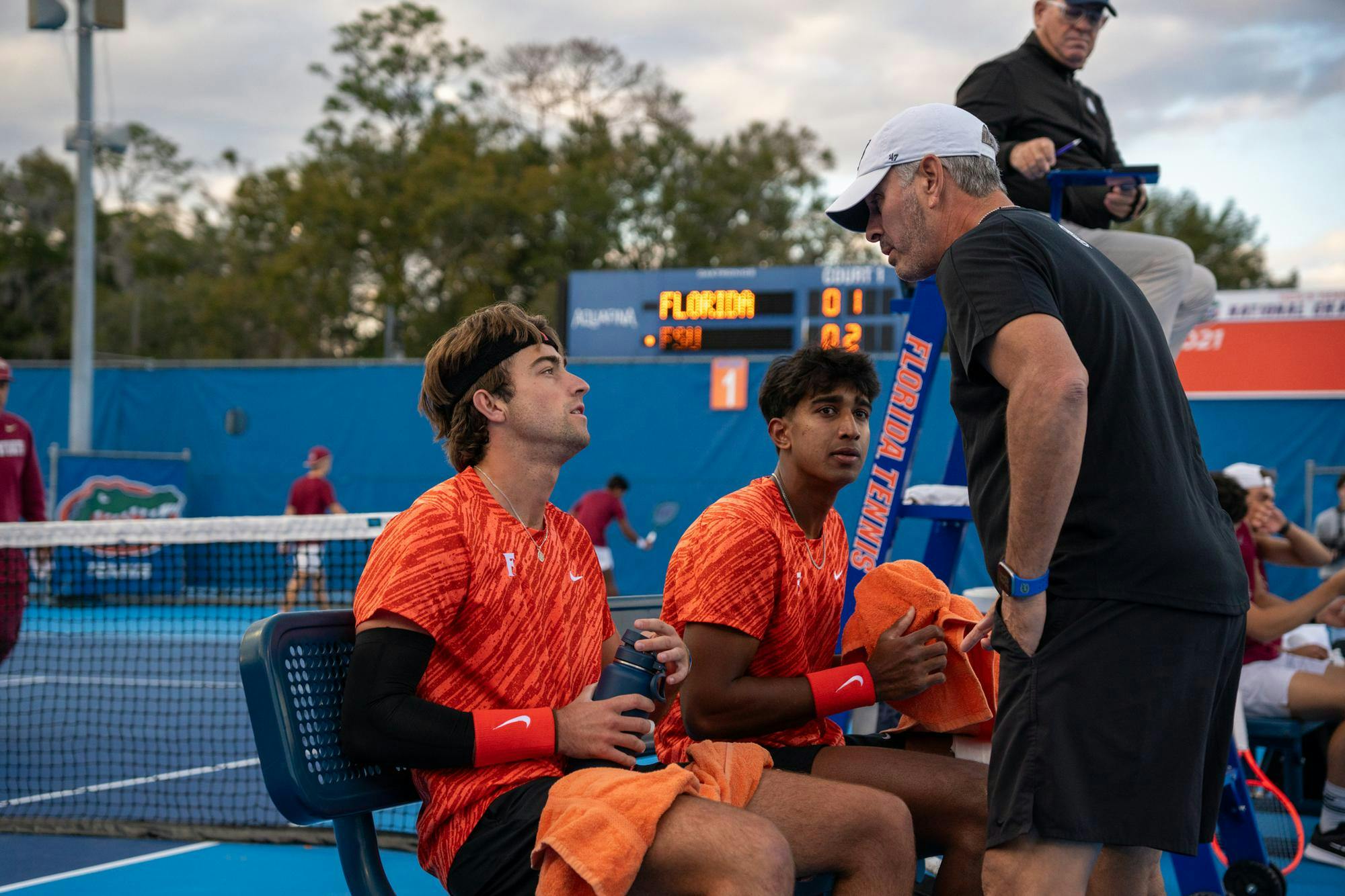 Florida’s men’s tennis head coach Adam Steinberg addresses players during an NCAA men's doubles tennis match against Florida State in Gainesville, Fla., Friday, Jan 30, 2026.