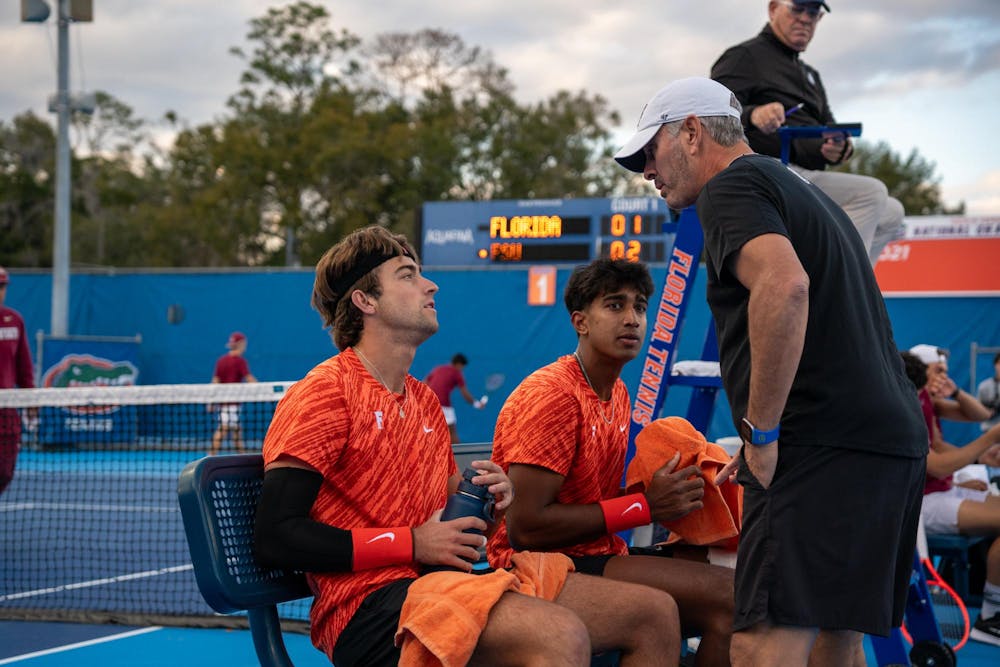 Florida’s men’s tennis head coach Adam Steinberg addresses players during an NCAA men's doubles tennis match against Florida State in Gainesville, Fla., Friday, Jan 30, 2026.