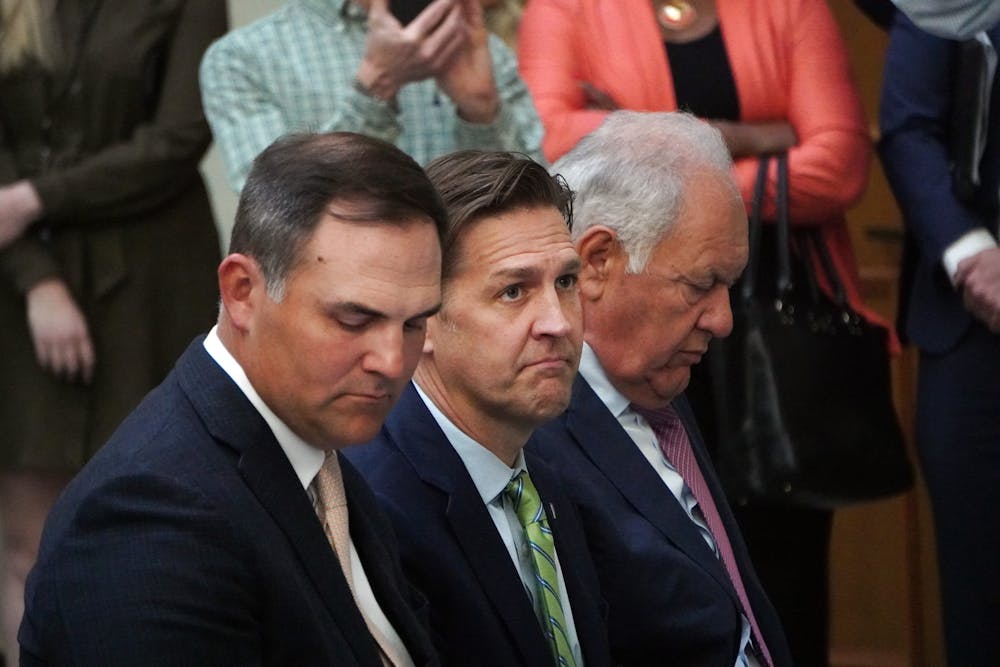 <p>New UF president Ben Sasse sits between Patrick Zalupski (left) and Mori Hosseini (right) during a press conference at Jacksonville City Hall Tuesday, Feb. 7, 2023.</p>