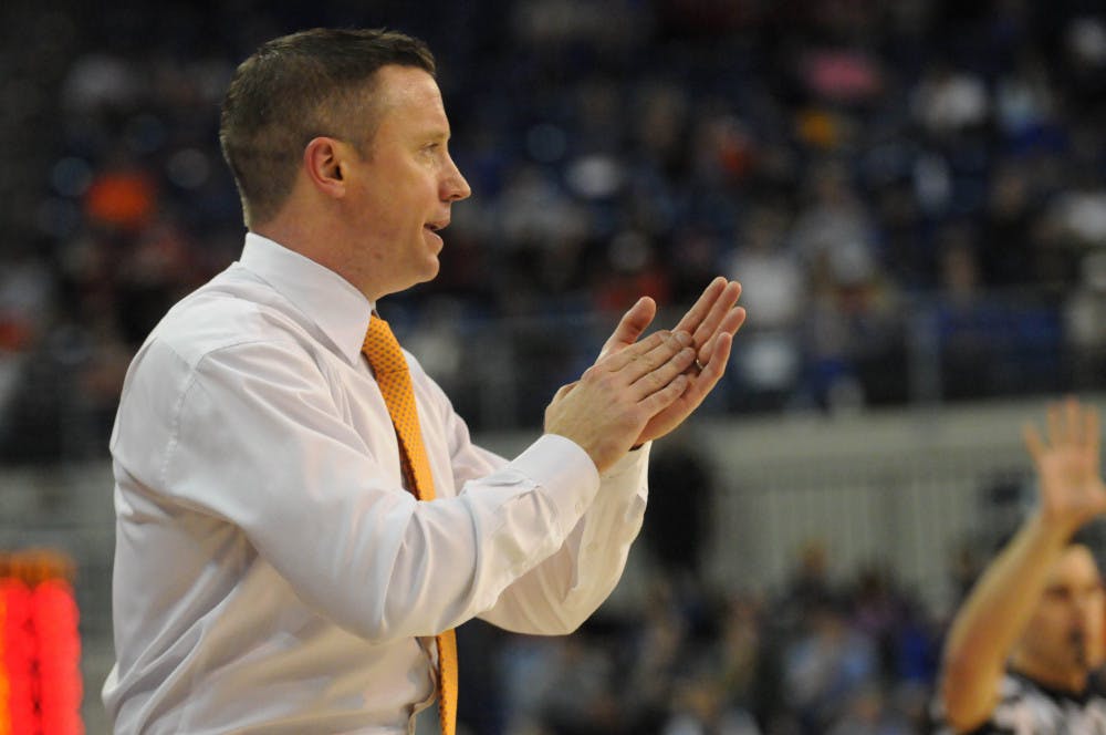 <p>UF coach Mike White celebrates after a play during Florida’s 77-63 win against Georgia on Jan.2, 2016, in the O’Connell Center.</p>