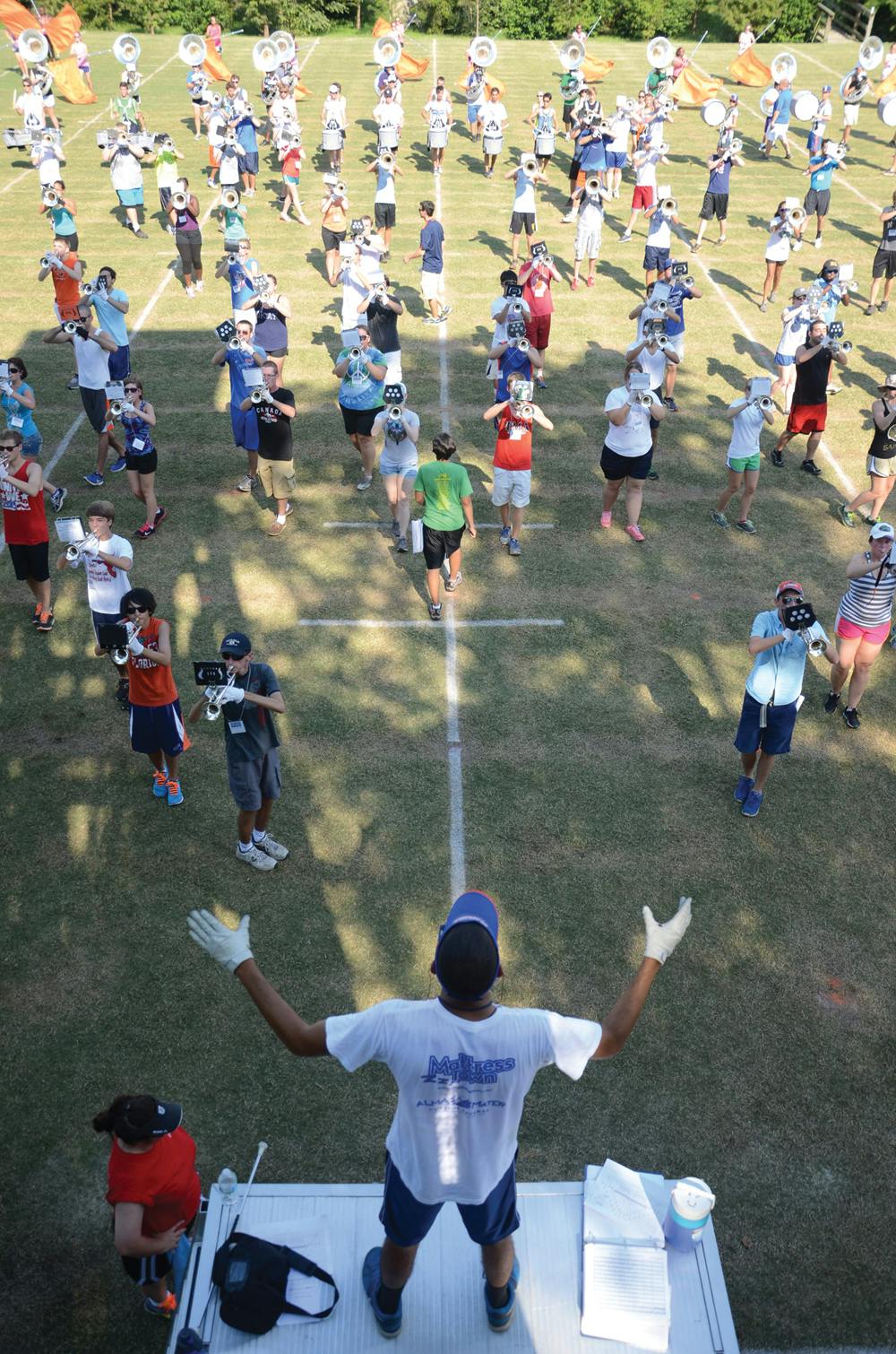 <p>UF marketing senior and Fightin’ Gator Marching Band drum major Freddy Masterson, 21, counts time during a practice Thursday afternoon.</p>