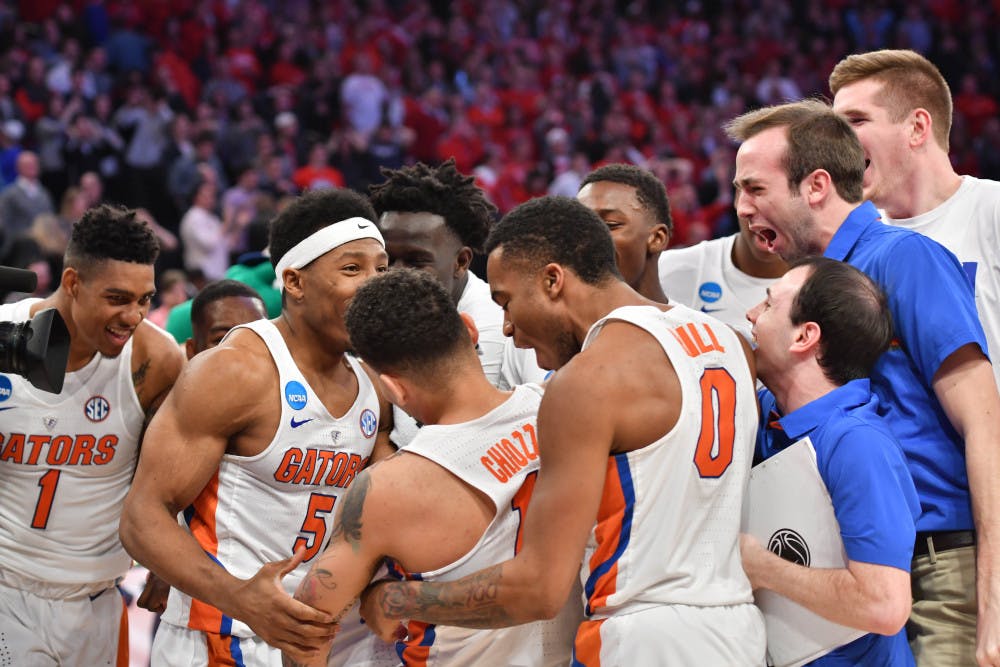 <p>Florida’s men’s basketball team celebrates after its 84-83 victory over Wisconsin in the NCAA Tournament on March 24, 2017, in New York City.</p>