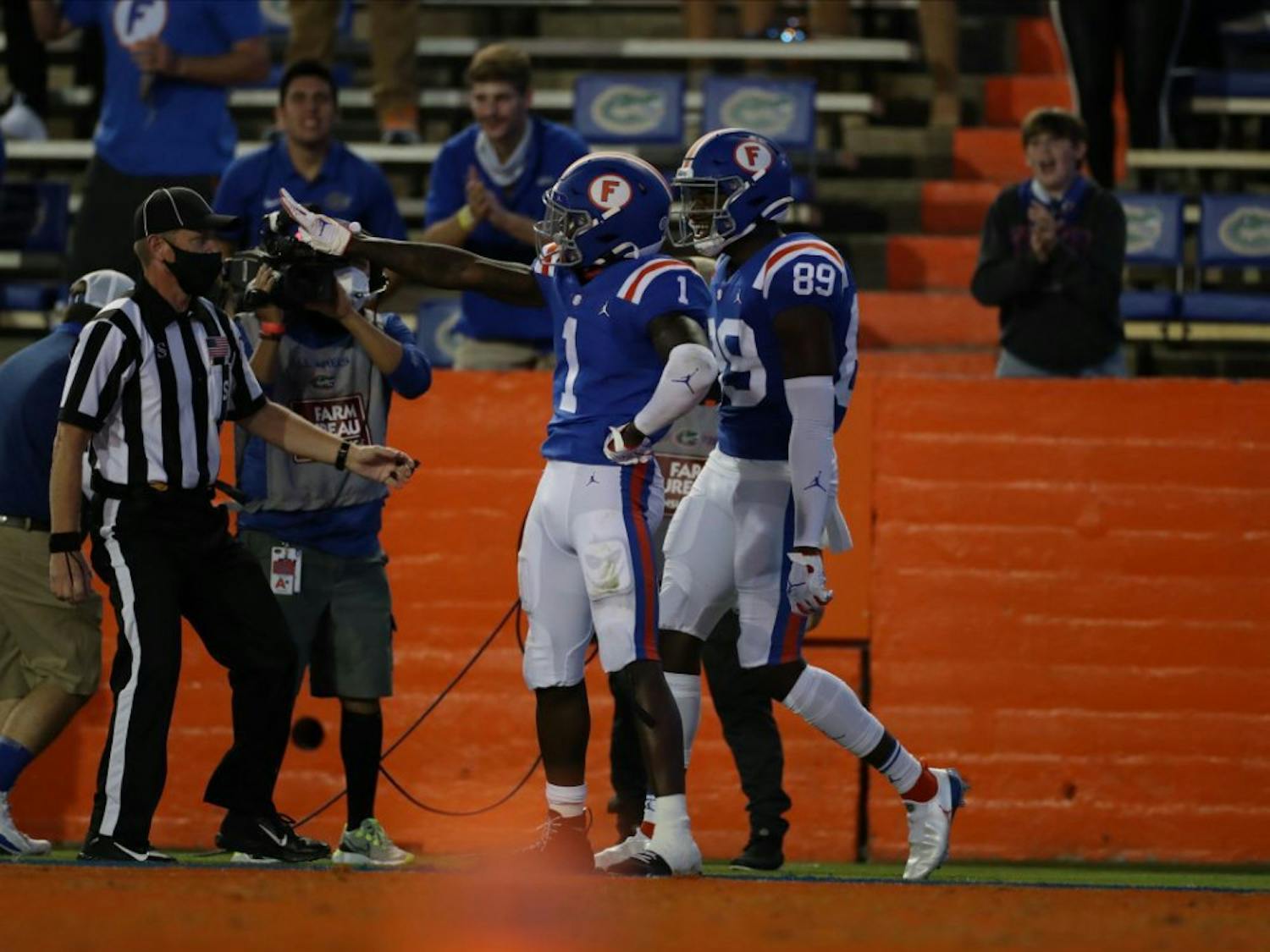 Kadarius Toney (1) and receiver Justin Shorter (89) celebrate a score in Saturday's win against Missouri.