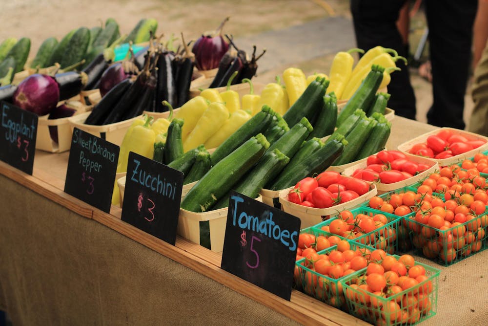 <p>Produce sits on a table at a farmers market on Monday, May 8, 2023.</p>