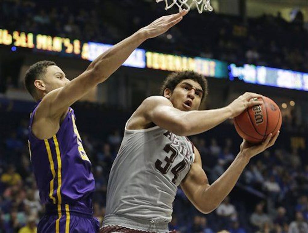 <p>Texas A&amp;M's Tyler Davis, right grabs a rebound against LSU's Ben Simmons, left, during the second half of an NCAA college basketball game in the Southeastern Conference tournament in Nashville, Tenn., Saturday, March 12, 2016. (AP Photo/Mark Humphrey)</p>