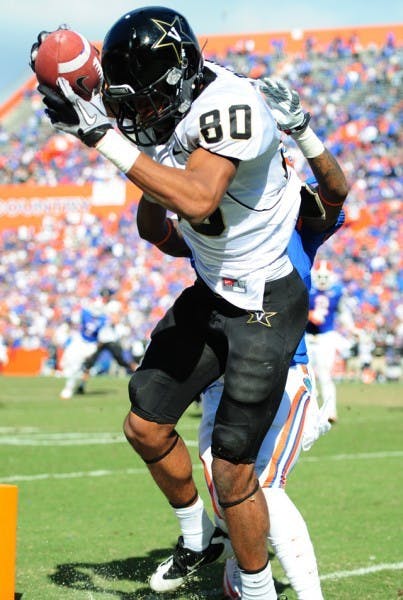 Vanderbilt receiver Chris Boyd catches a fourth-quarter touchdown over UF corner Marcus Roberson. UF allowed 297 passing yards.