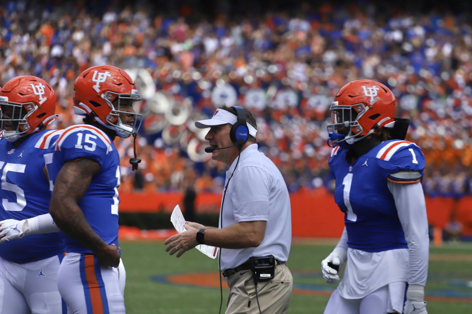 Florida head coach Dan Mullen on the sideline with Anthony Richardson (15) and Brenton Cox Jr. (1) during Florida's Oct. 16 game against Vanderbilt.