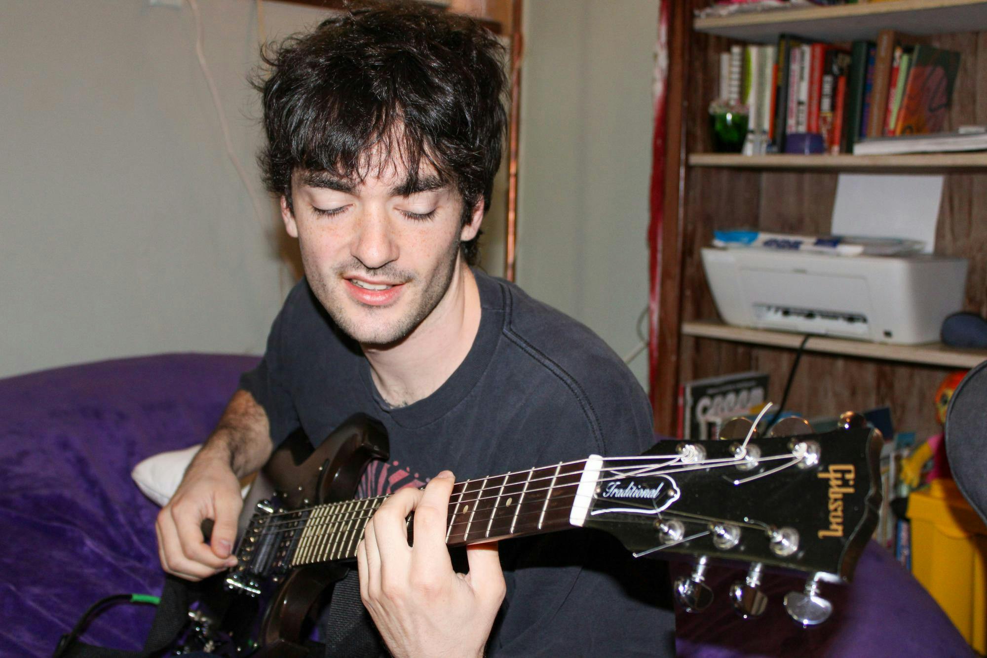 Luke Sechrest, a member of the local band Rustler, plays his guitar Friday, August 21, 2026, in Gainesville, Fla.
